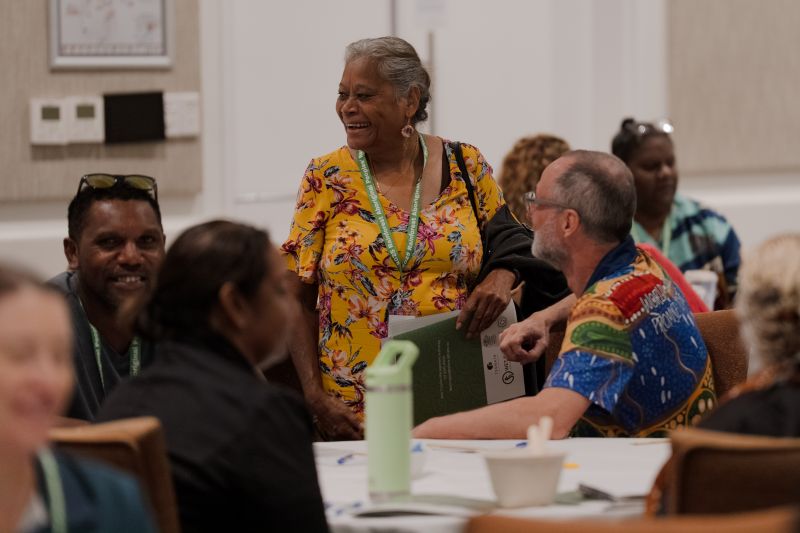 People talking at a conference.