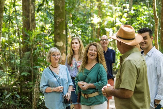 Group of people on a tour in a rainforest.